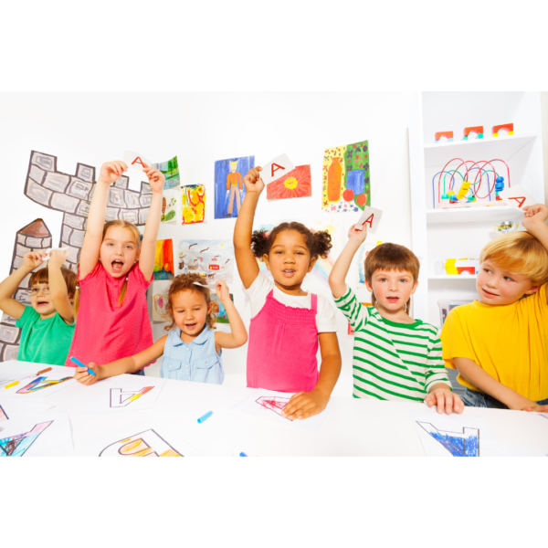 kindergarten students holding up the letter 'A" using behavior management strategies